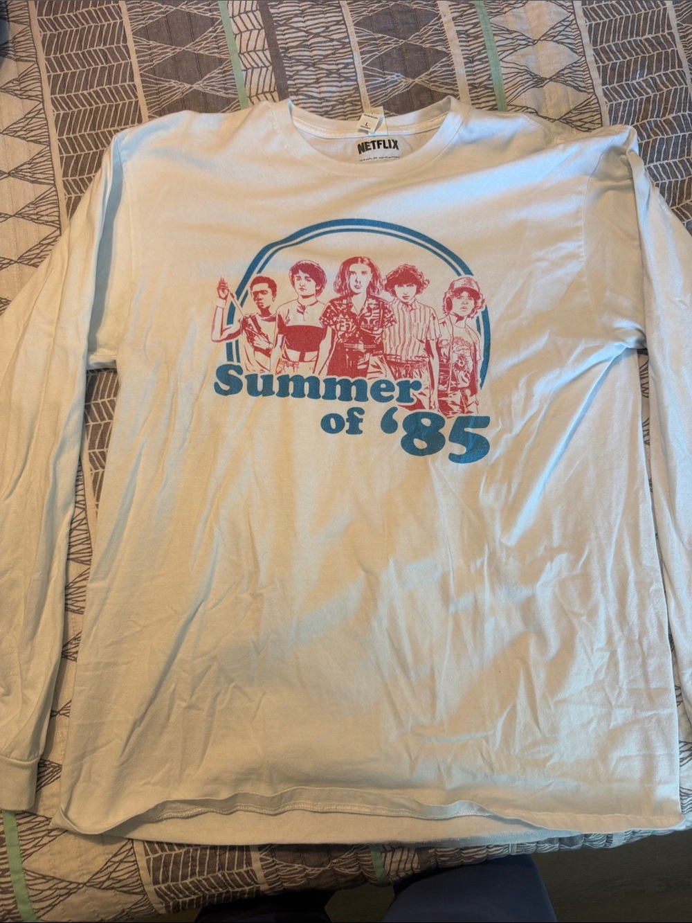 Netflix White Long Sleeve Tee with Blue & Red 'Summer of 85' Graphic